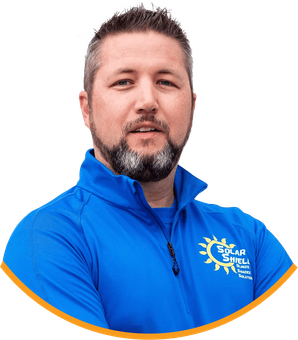 A man with a beard is wearing a blue shirt that says solar shield