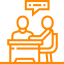 Two people are sitting at a table talking to each other.