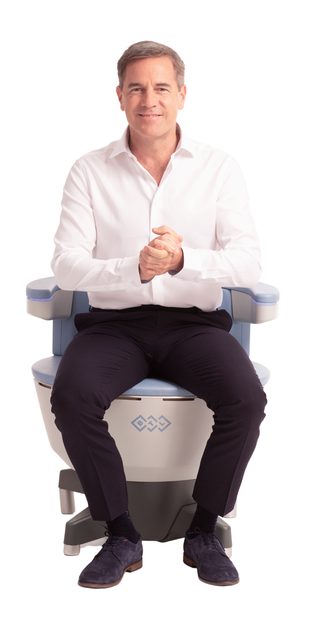 A man is sitting on a chair with his legs crossed.