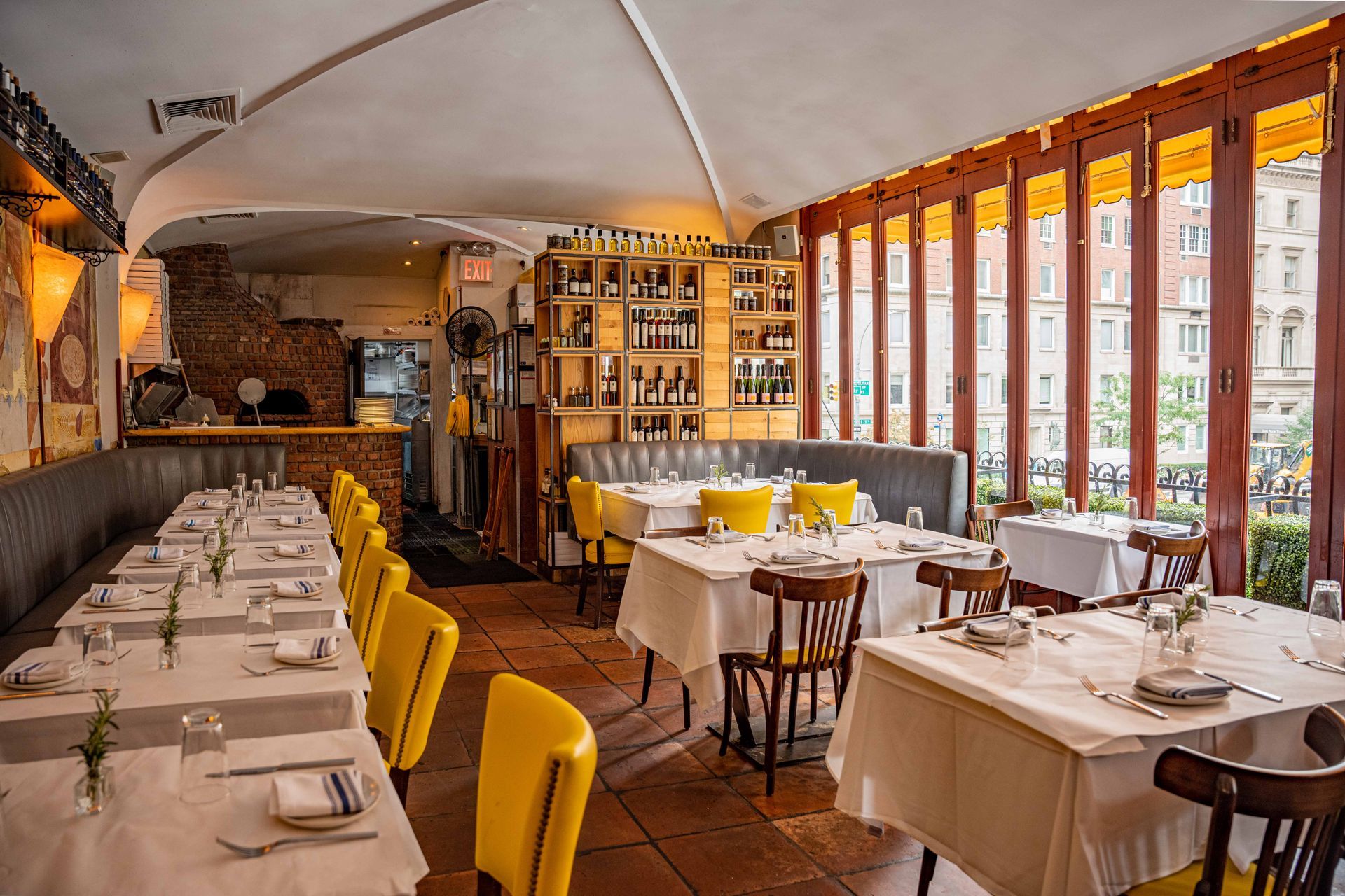 Interior of Serafina 79th, showcasing a bright and dining space with large windows that fill the room with natural light. 