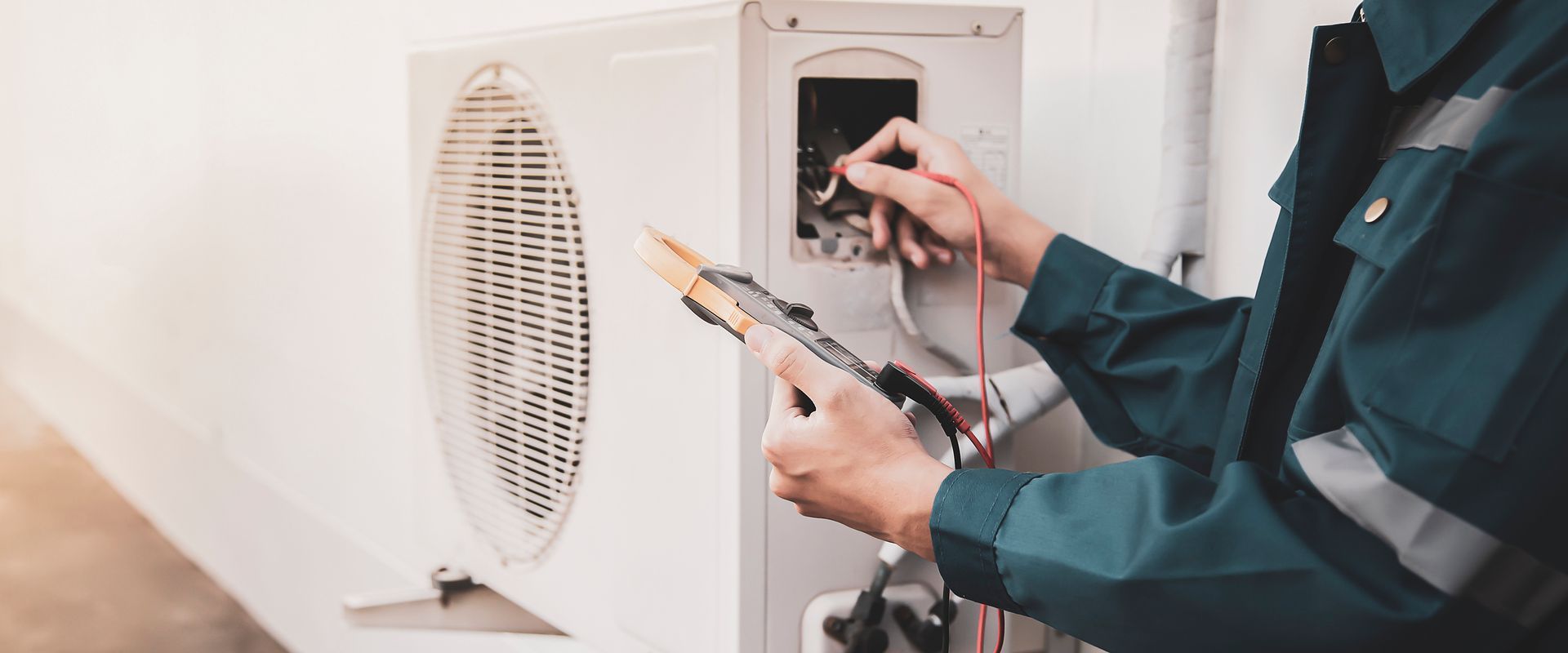 Technician checking the operation of a AC Repair