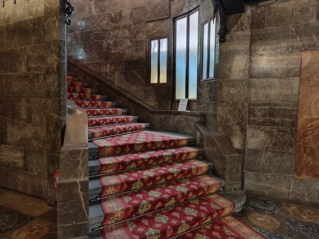Palau Güell Barcelona A set of stairs with a red carpet on them