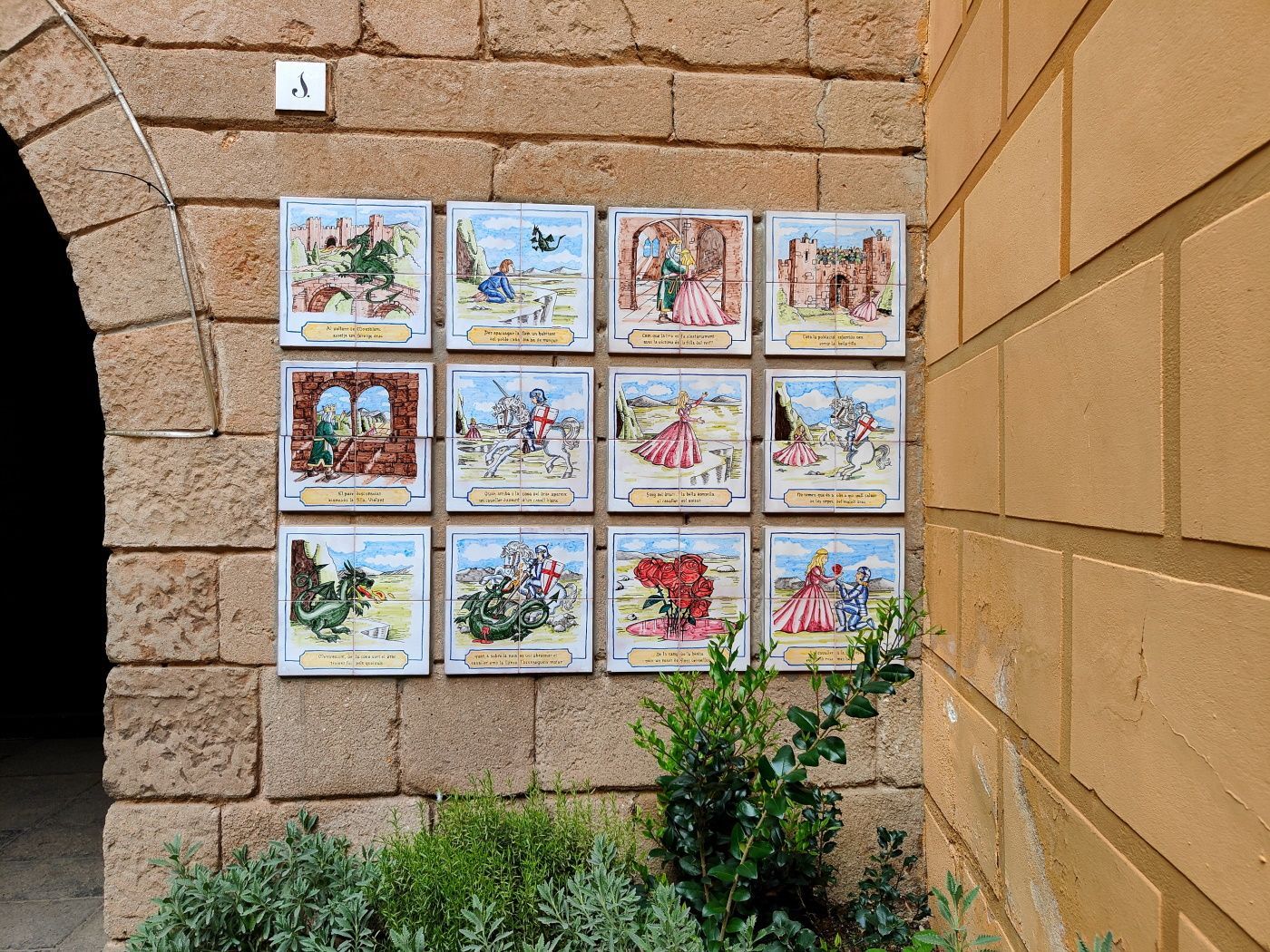 A brick wall with a bunch of pictures on it