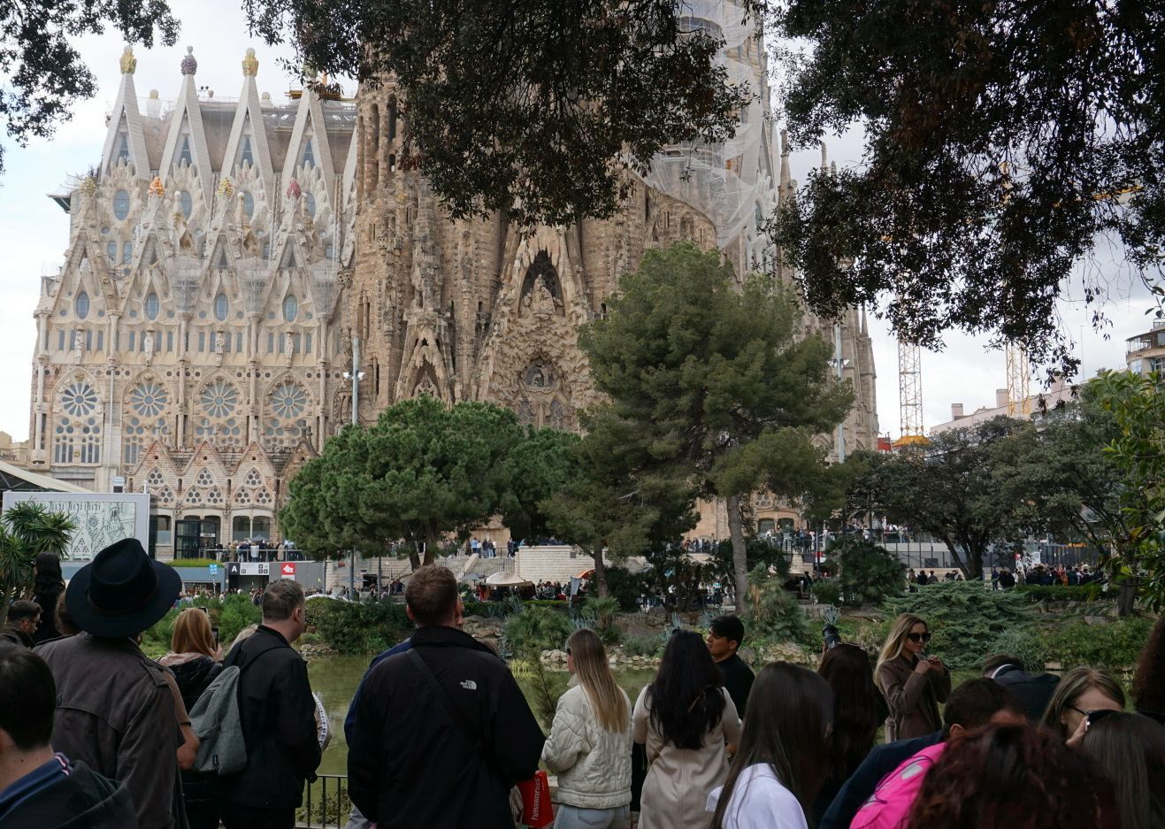 A group of people standing in front of a large building