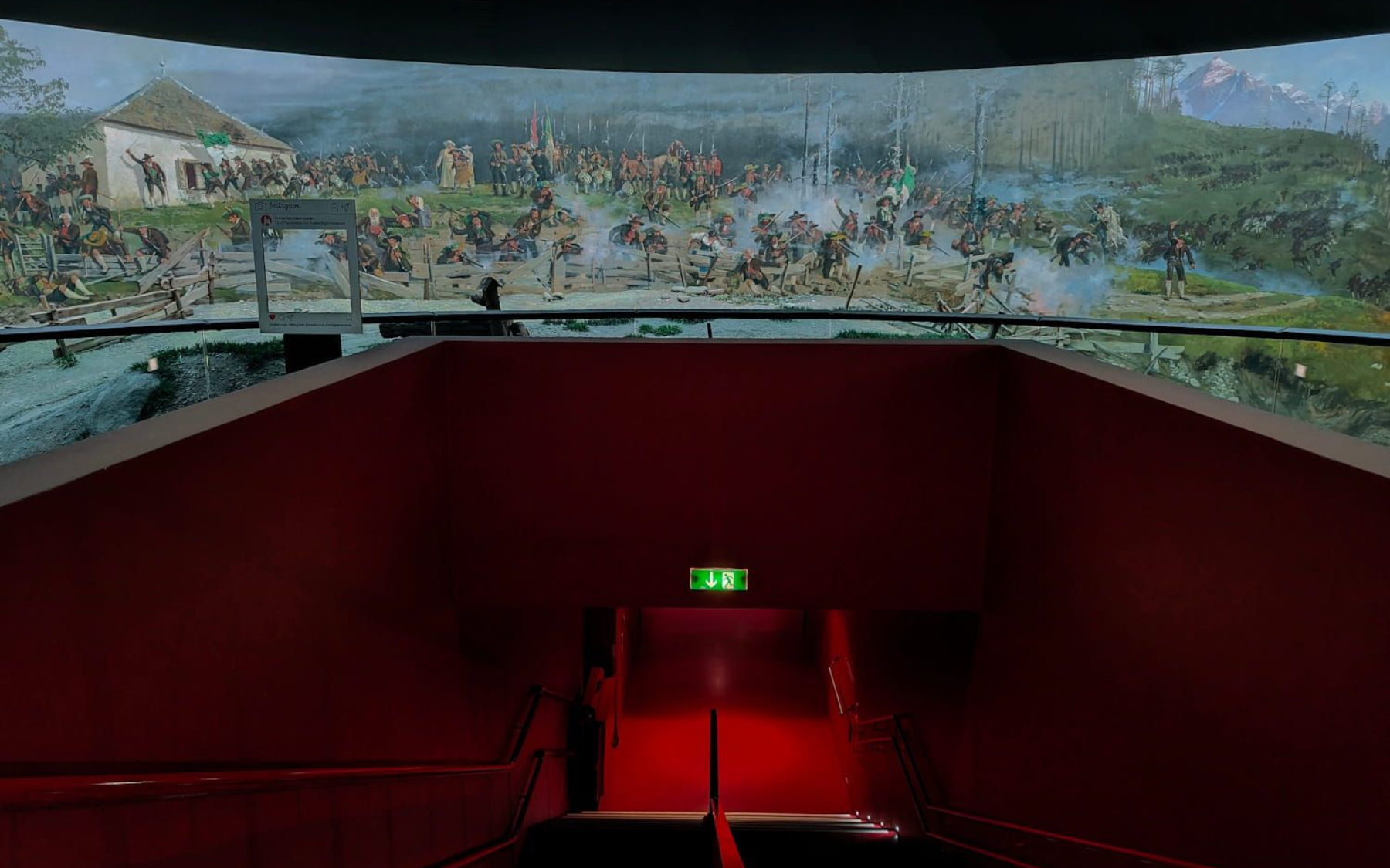 Tirol Panorama View from red stairway into a battle scene panorama. Dark setting, exit sign.