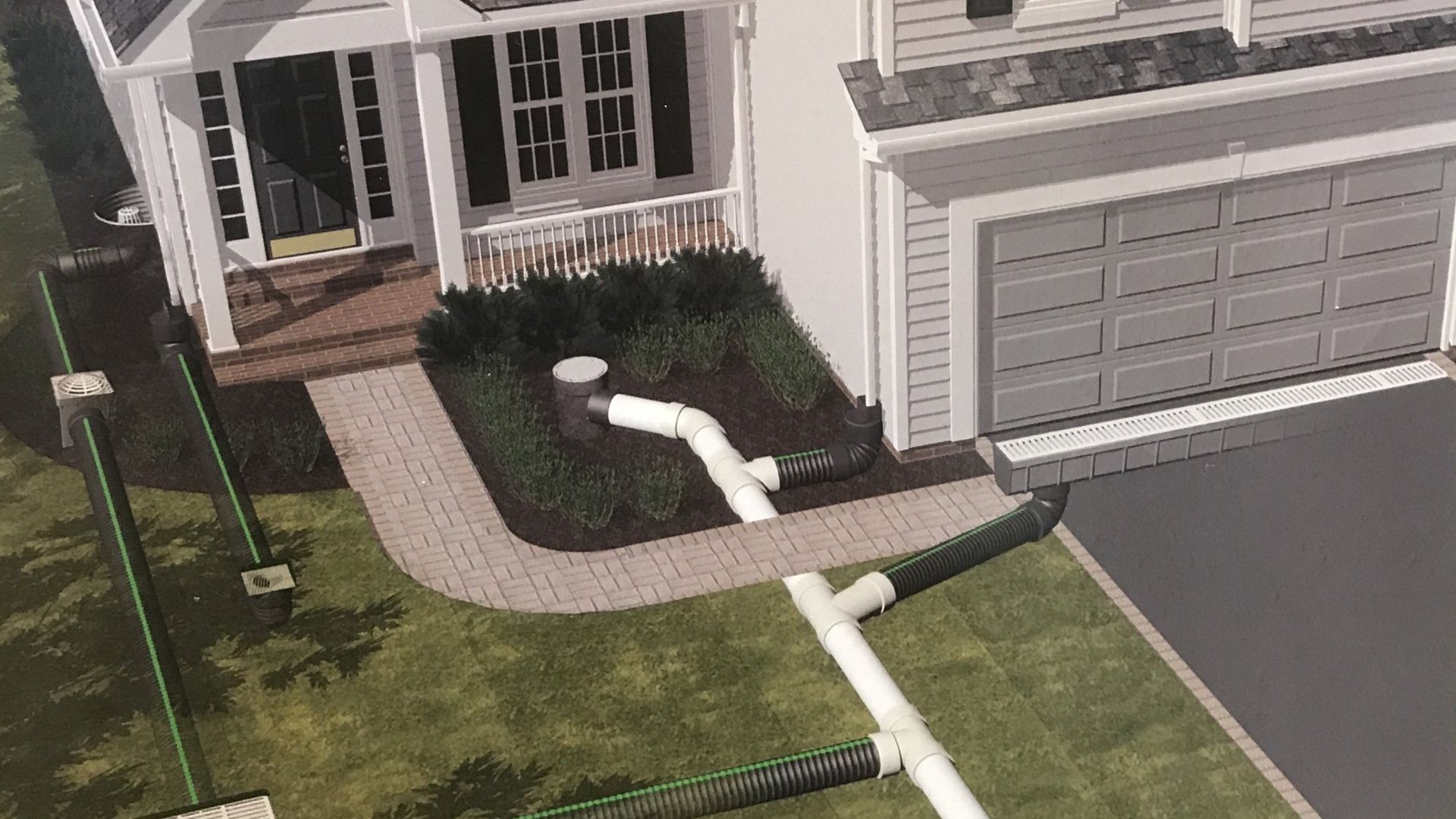 An aerial view of a house with drain pipes in front of it.