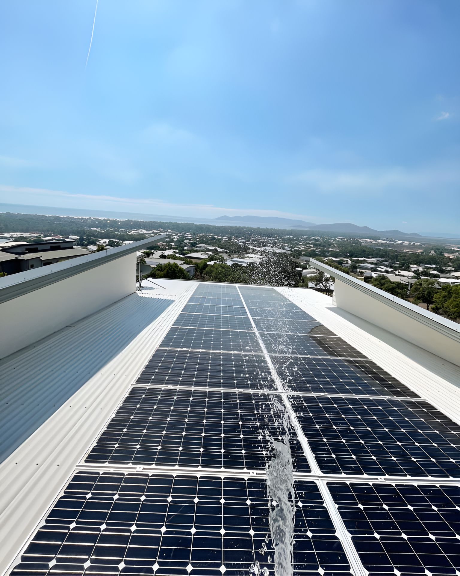 A Row Of Solar Panels On The Roof Of A Building — Waltlec Industries In Garbutt, QLD