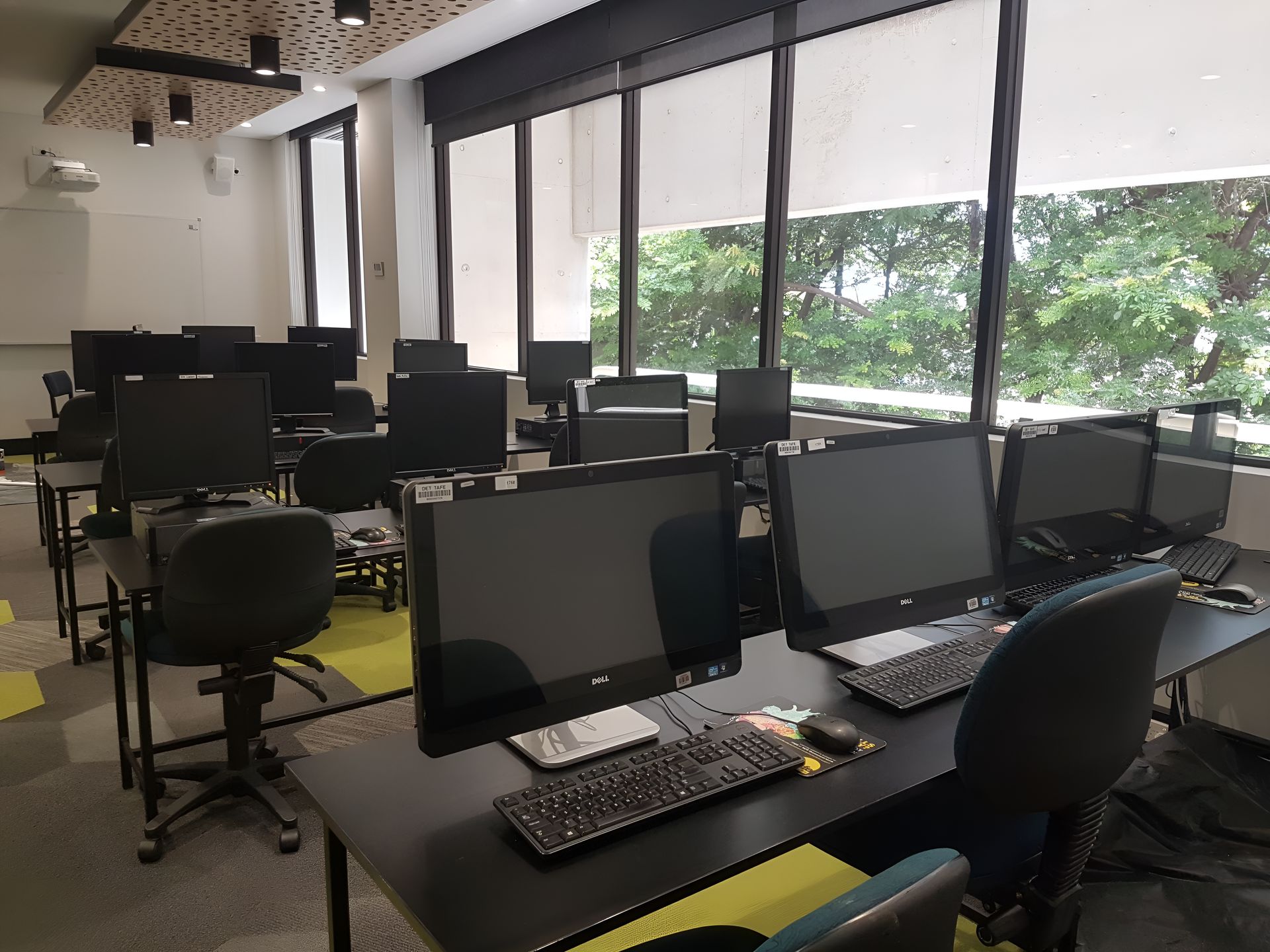 A Classroom With A Lot Of Computers And Chairs — Waltlec Industries In Garbutt, QLD