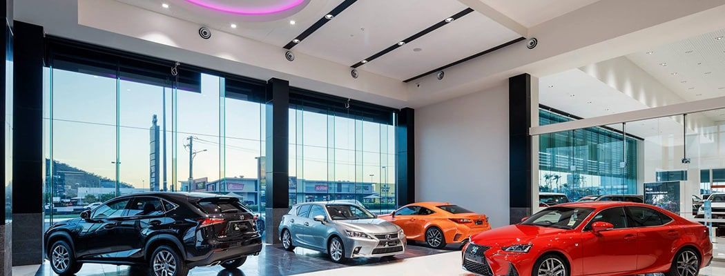 A Showroom with A Lot of Cars on Display in It — Waltlec Industries In Garbutt, QLD