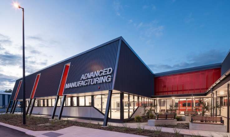 A Large Building with A Lot of Windows and A Sign that Says Advanced Manufacturing — Waltlec Industries In Garbutt, QLD