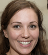 A close up of a woman 's face with a smile on her face