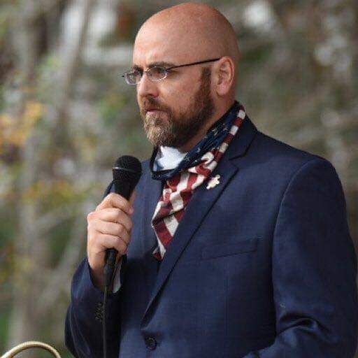 Jason King speaking with microphone