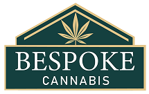 Gold-and-green Bespoke Cannabis logo with a stylized cannabis leaf inside a house-shaped outline.