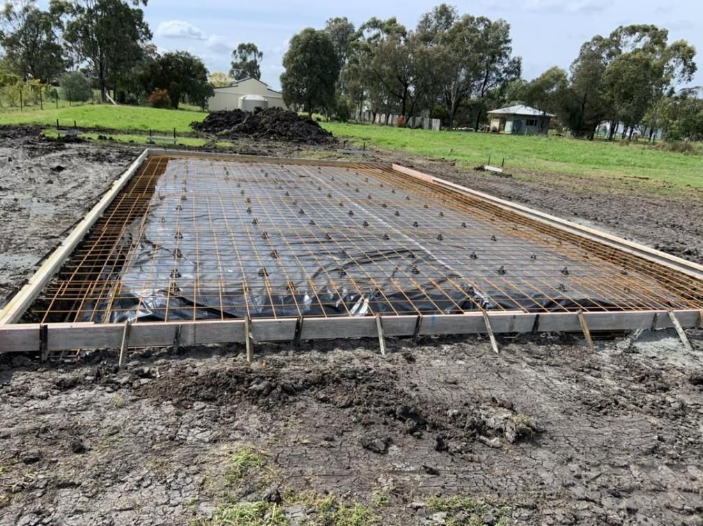 A Concrete Slab Is Being Built in A Field with Trees in The Background — Pedro's Concreting in Highfields, QLD