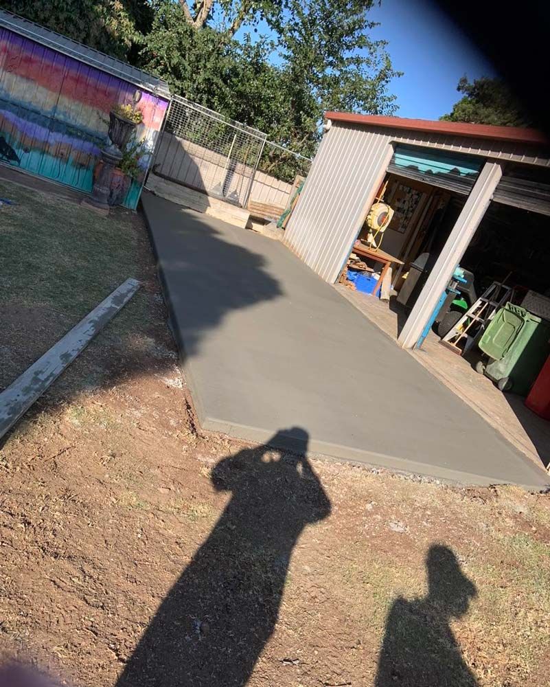 Concrete Driveway in Front of a Garage — Pedro's Concreting in Pittsworth, QLD