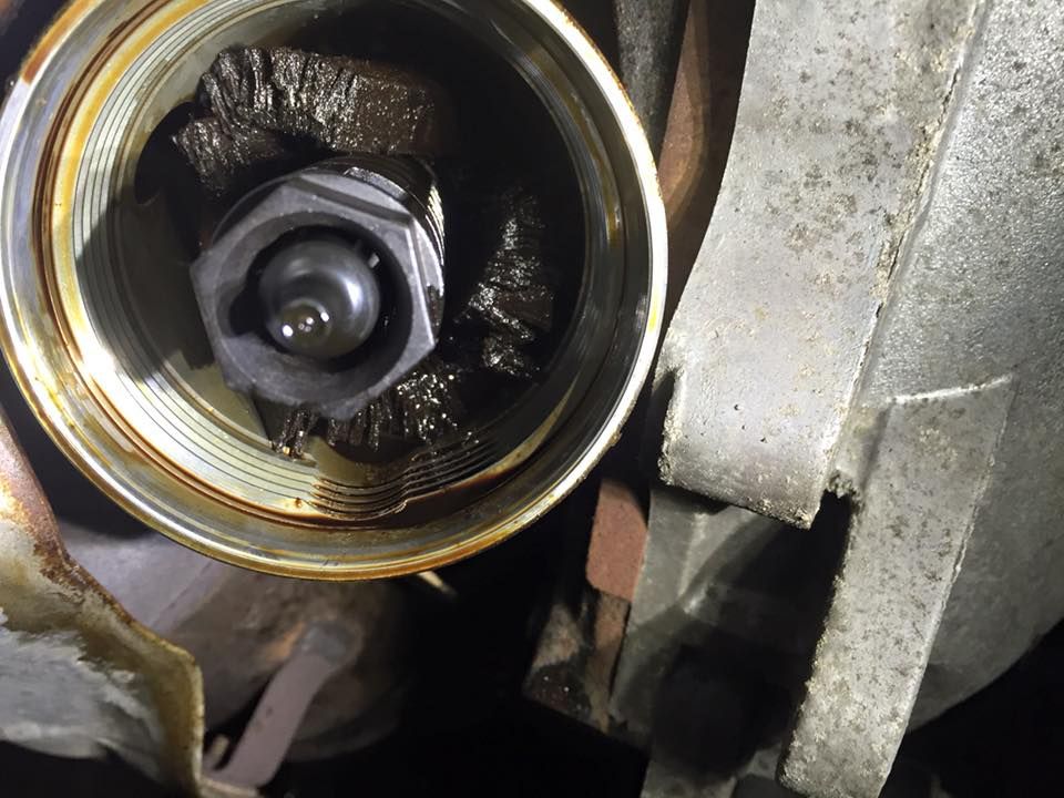 Close Up of a Metal Object With Oil on It — Kirra Mechanical in Coolangatta, QLD