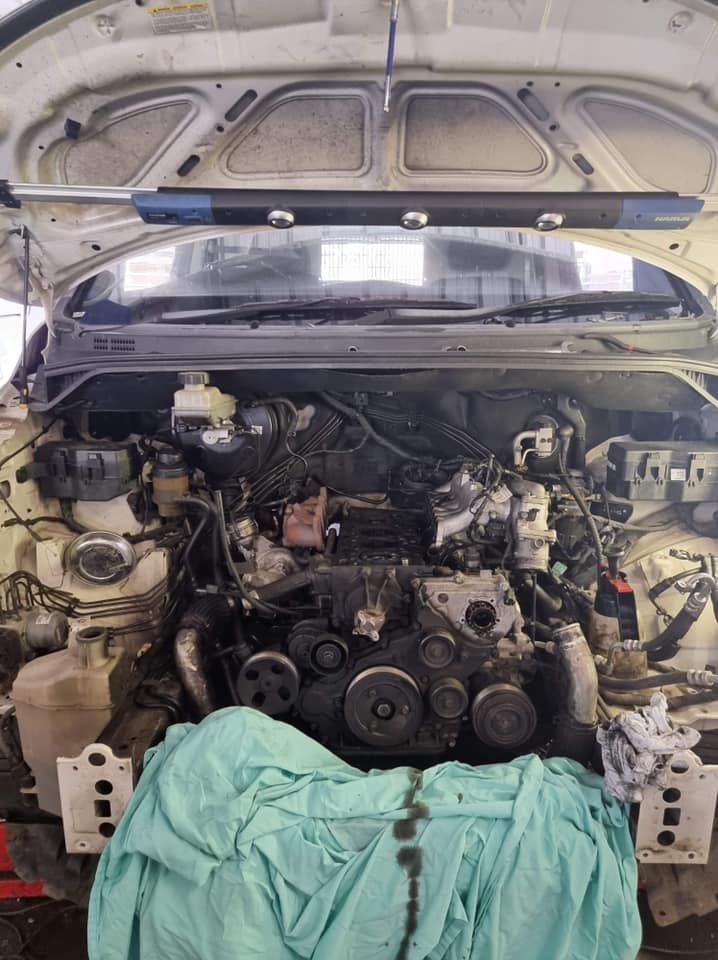 The Engine of a Car is Being Worked on With the Hood Open — Kirra Mechanical in Coolangatta, QLD