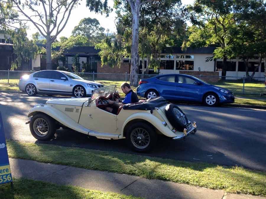 Old MG TF car being parked outside and being serviced by a mechanic — Kirra Mechanical in Coolangatta, QLD