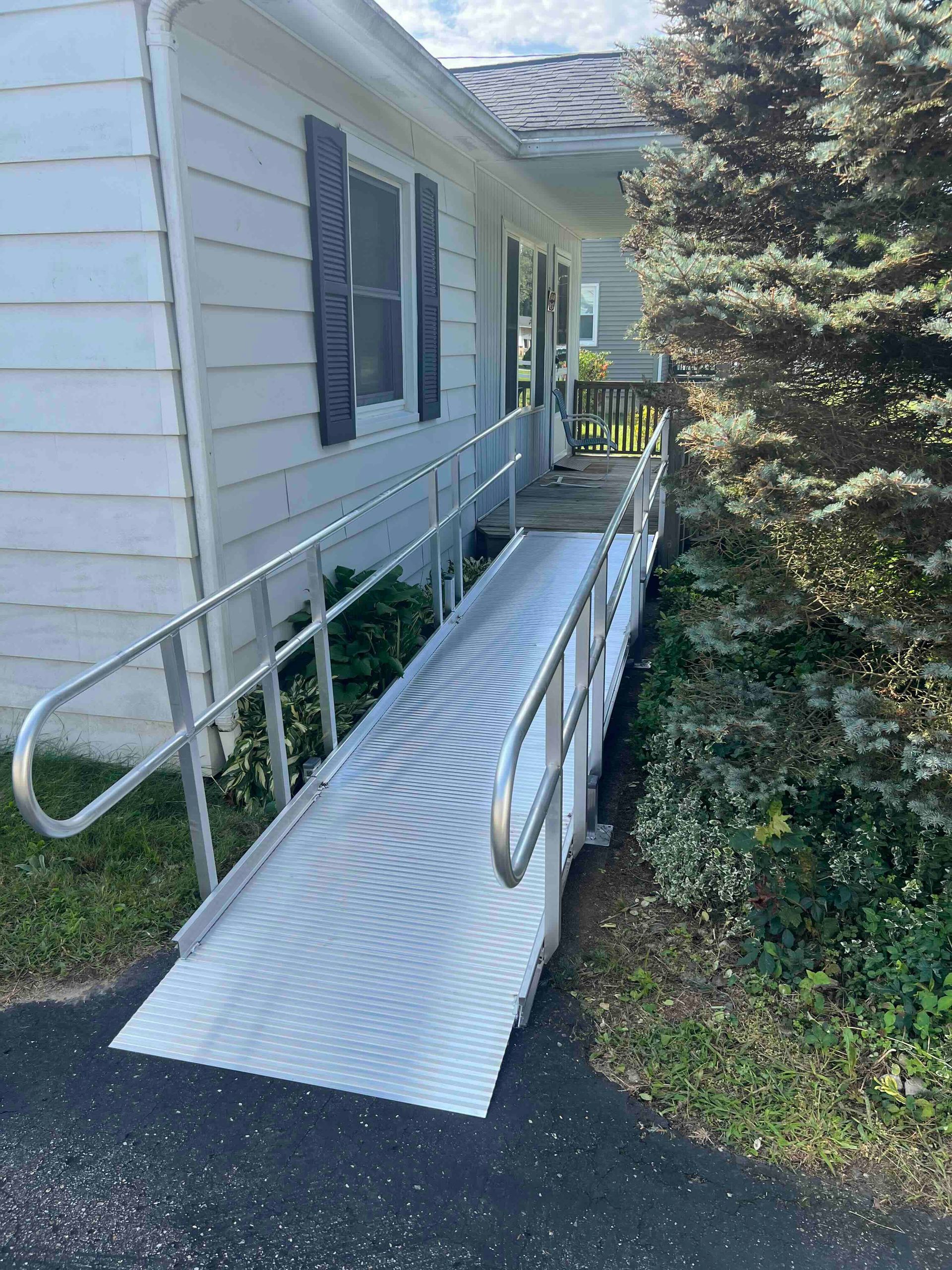 There is a ramp leading to the front of the house.