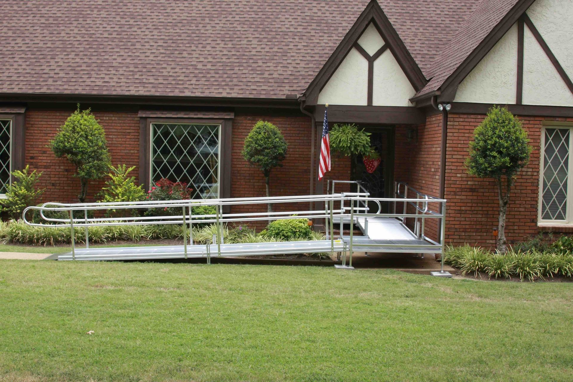A brick house with a ramp in front of it