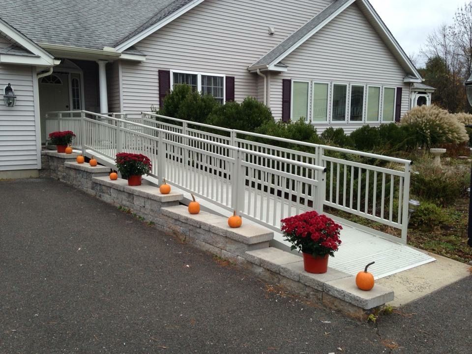 There is a ramp leading to the front of the house.