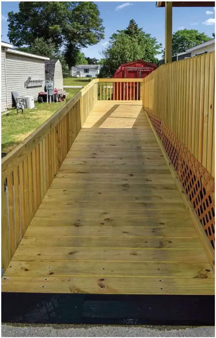 a wooden ramp leading to a home.