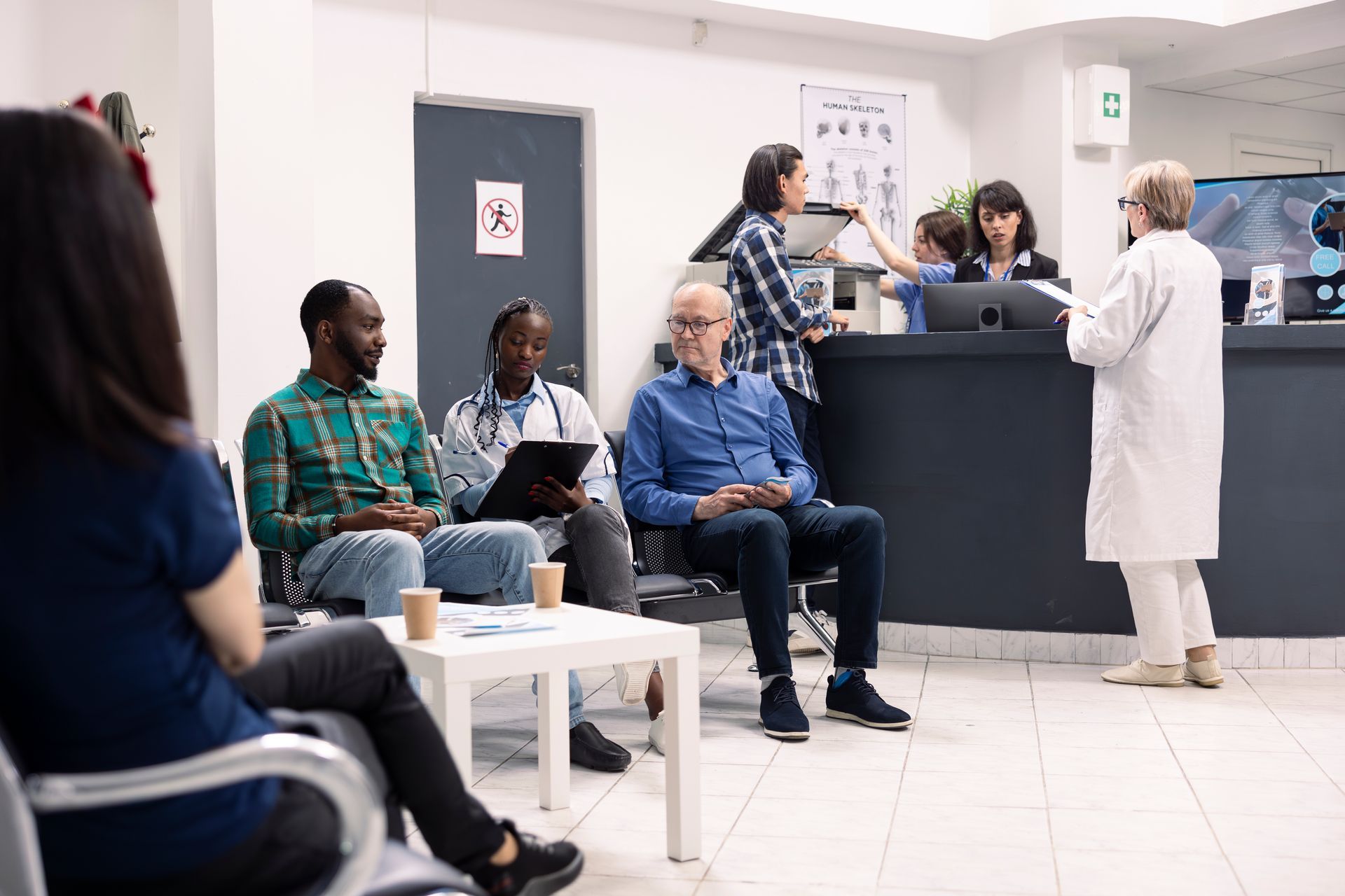 People waiting in a medical clinic: a doctor, reception desk, and seated patients.