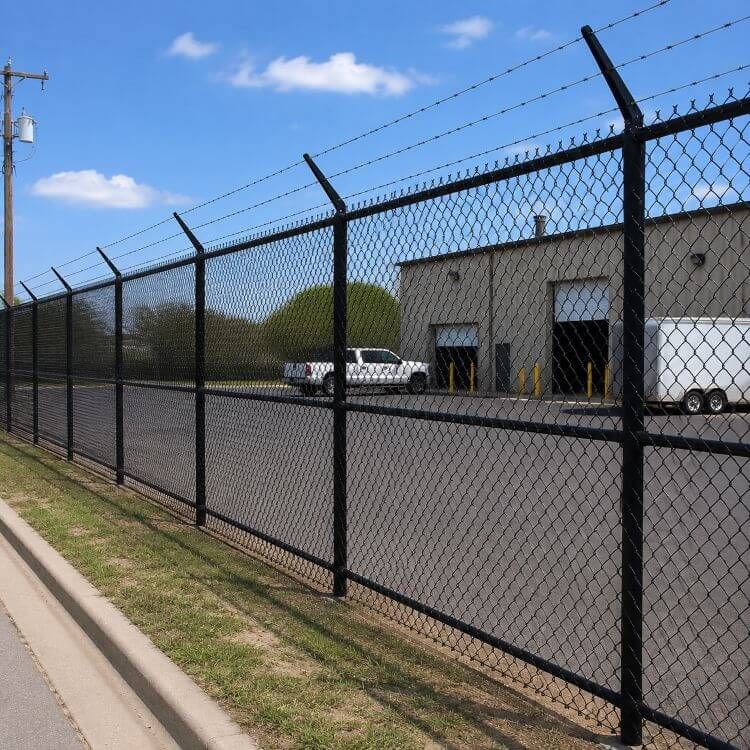 Commercial fence securing an outdoor work area in San Angelo