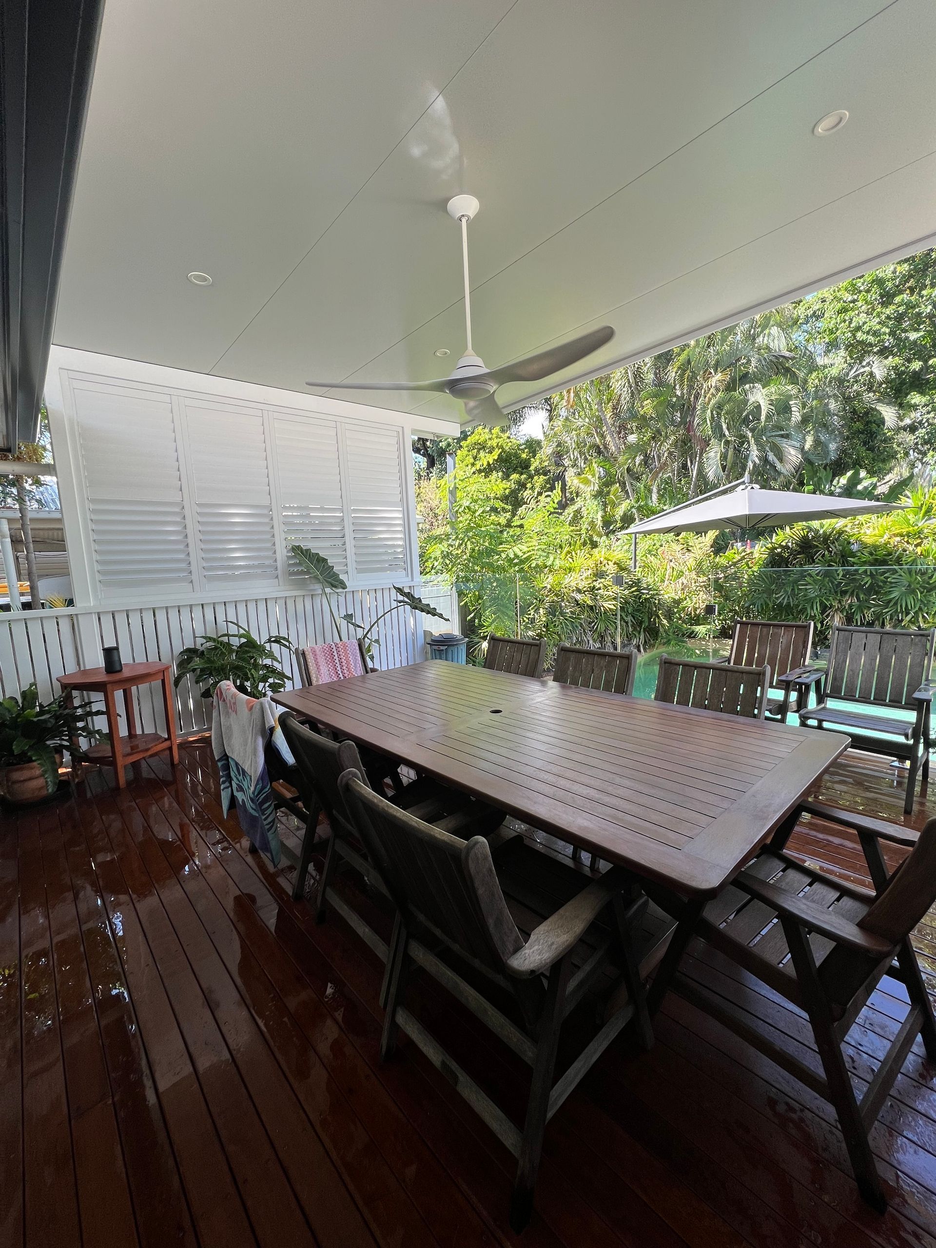 An Outdoor Decking Area With Seating Area — Darryl Tickle Building Pty Ltd In Alice River, QLD
