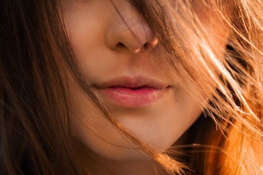Close-up of a woman’s lips in soft natural light