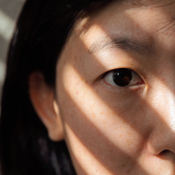 Close-up of the skin on a woman’s nose and cheek
