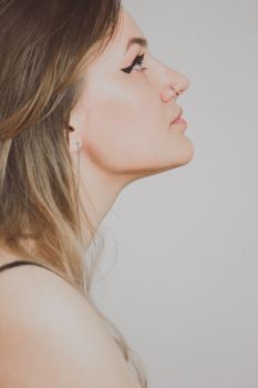 Side profile of a woman's nose and face