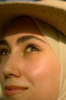 Close-up of a smiling woman’s eye area showing natural smile lines