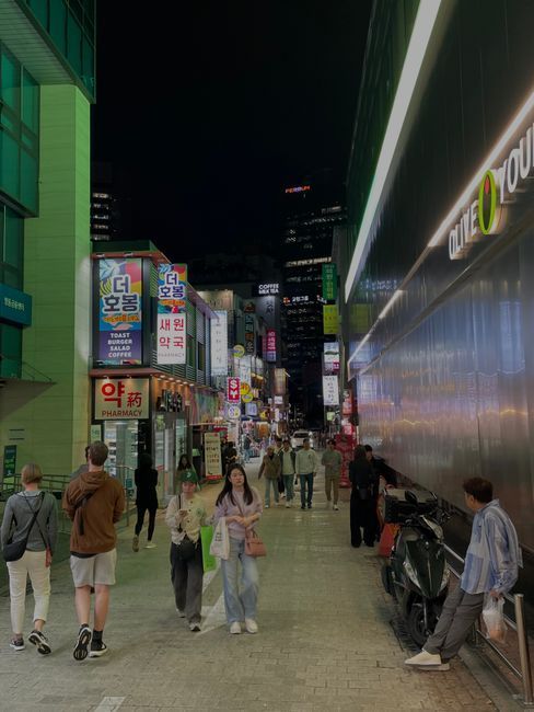 Busy shopping street in Myeongdong, central Seoul, in the evening