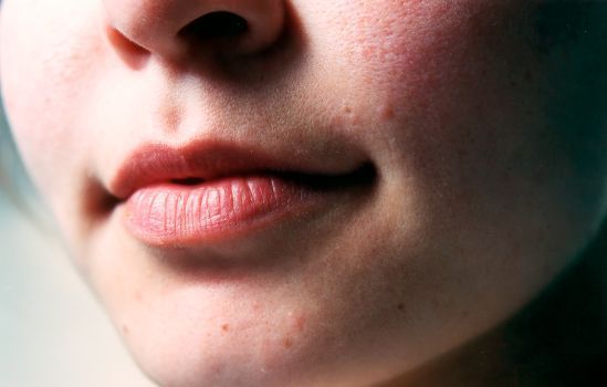 Close-up of a woman's lips and smile