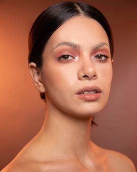 Woman with luminous, glowing skin in soft light