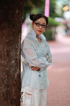 Woman with a bright, even complexion outdoors in daylight