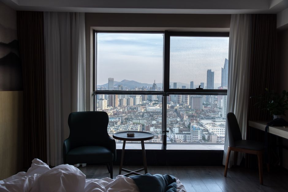 A bright hotel room with a view over central Seoul