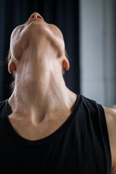 Woman tilting her head up, showing the chin and neck