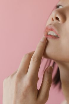 Close-up of a woman’s natural lips in soft light