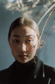 Woman with a calm expression in soft daylight