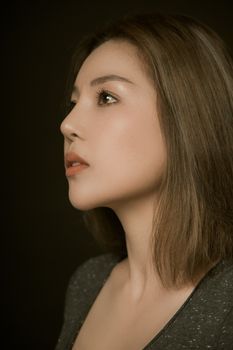 Side profile of a woman's lower face and jawline