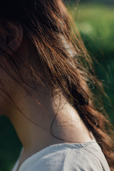 Back view of a woman's neck and shoulders
