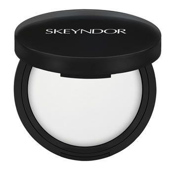 Un contenedor de polvo skeyndor con tapa negra.