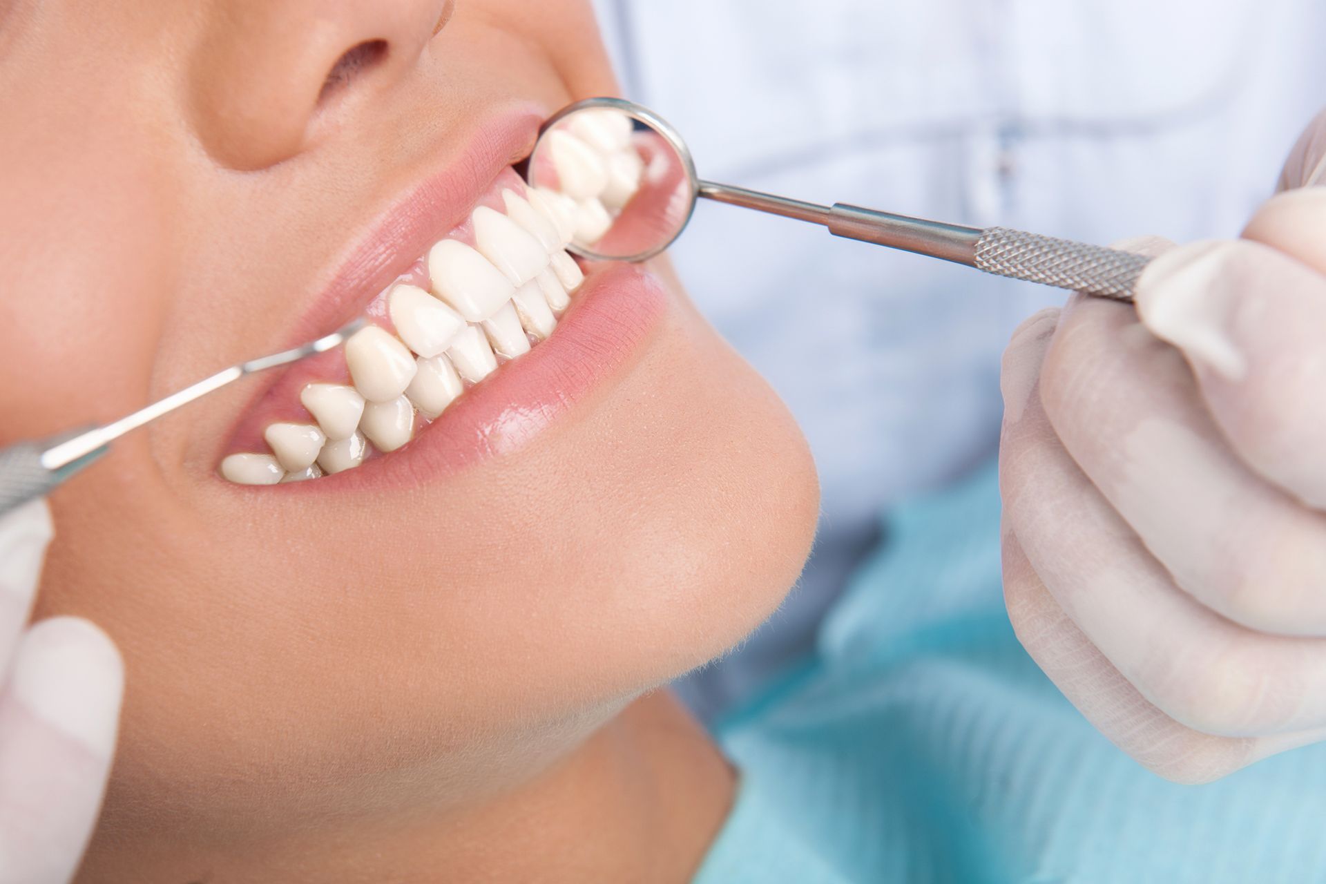 Close-up of teeth being examined by a dentist | Steven A. Kumasaka