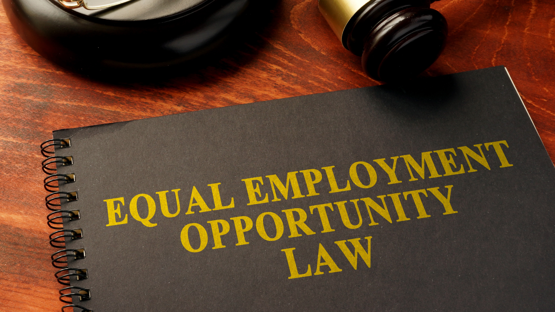 Employment law handbook and gavel representing workplace compliance