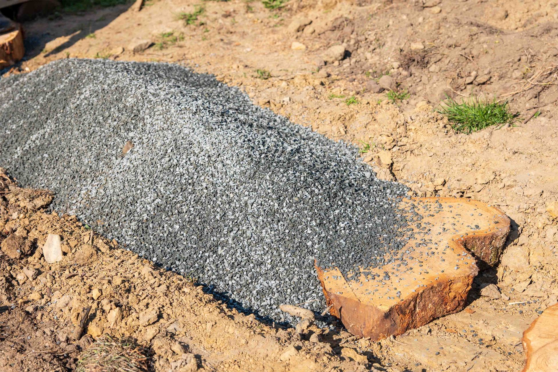 A person is using a hammer to break concrete.