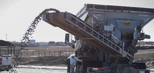 A person is using a hammer to break concrete.