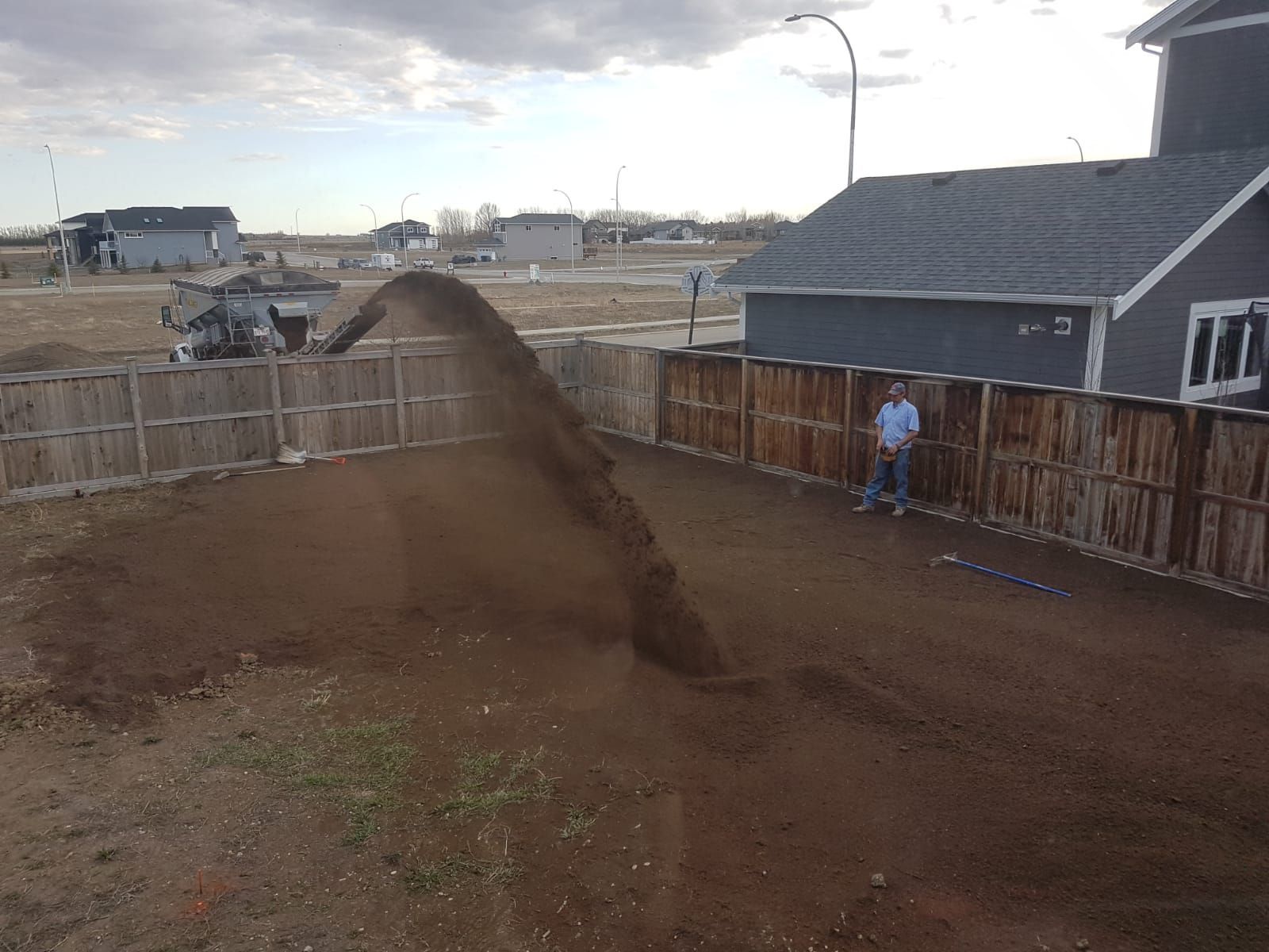A person is using a hammer to break concrete.