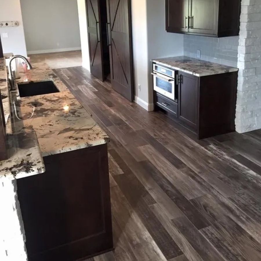 a kitchen with a sink , stove , and cabinets